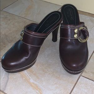 Coach heeled closed toe shoe. Brass buckle.